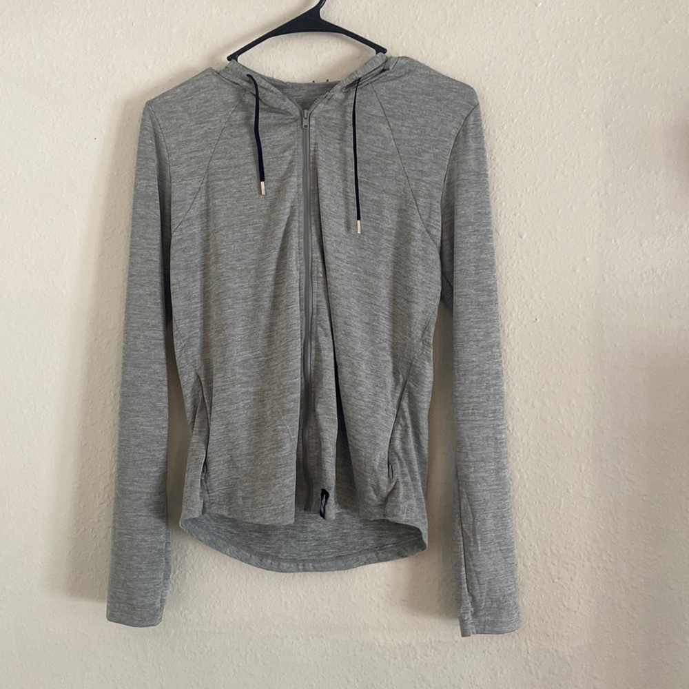 Teton Gravity Research branded zip up hoodie.